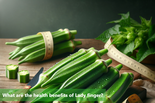 A close-up image of fresh lady fingers on a wooden table.