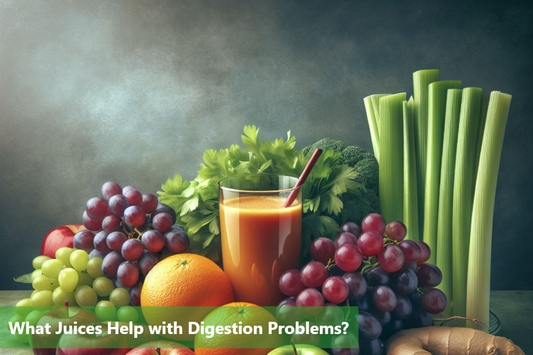 A variety of fruits and vegetables are arranged on a table, including grapes, apples, oranges, celery, and ginger.