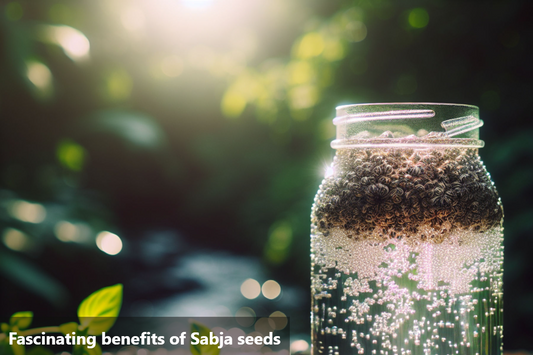 A jar of sabja seeds with a close up of the seeds and a green background.