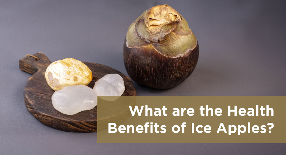 A close-up image of fresh ice apples on a wooden table with a tropical background.