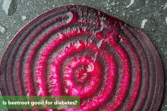 A close-up image of a sliced beetroot, showcasing its vibrant red and white rings.