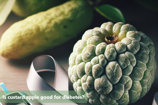 A custard apple, a green cucumber and a blood glucose meter on a wooden table.