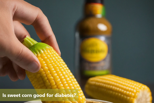 A close-up of a hand holding a cob of sweet corn.