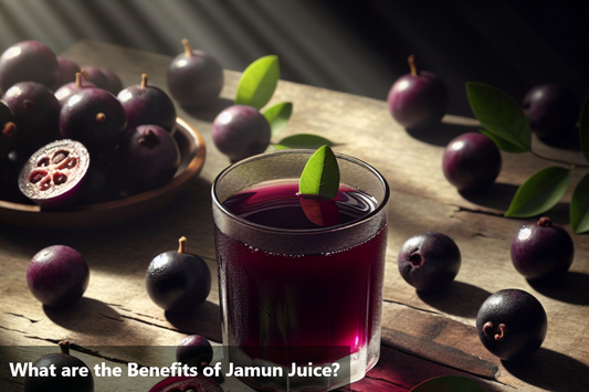 A glass of jamun juice with jamun fruits on a wooden table.